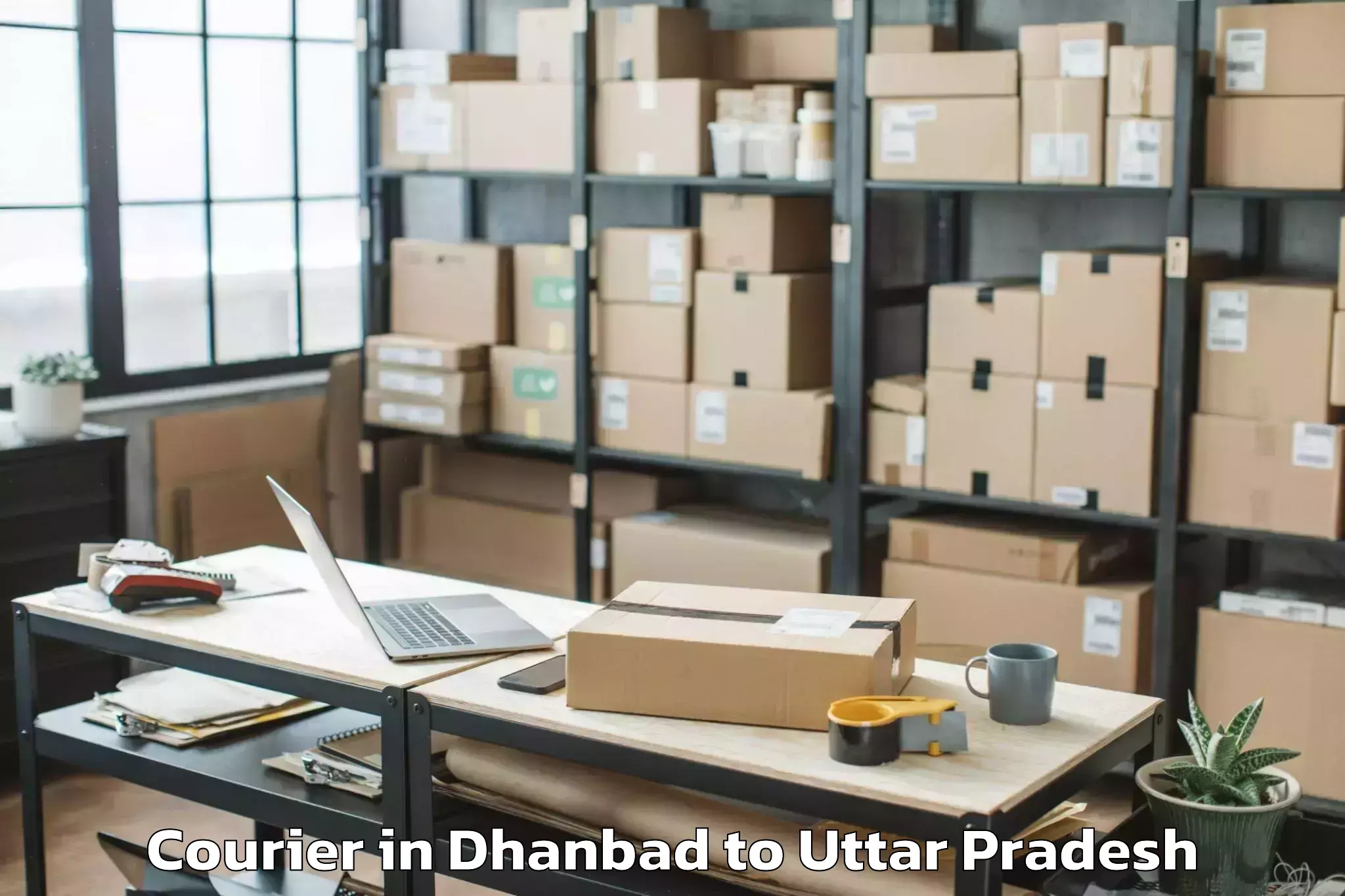 Easy Dhanbad to Maniar Courier Booking